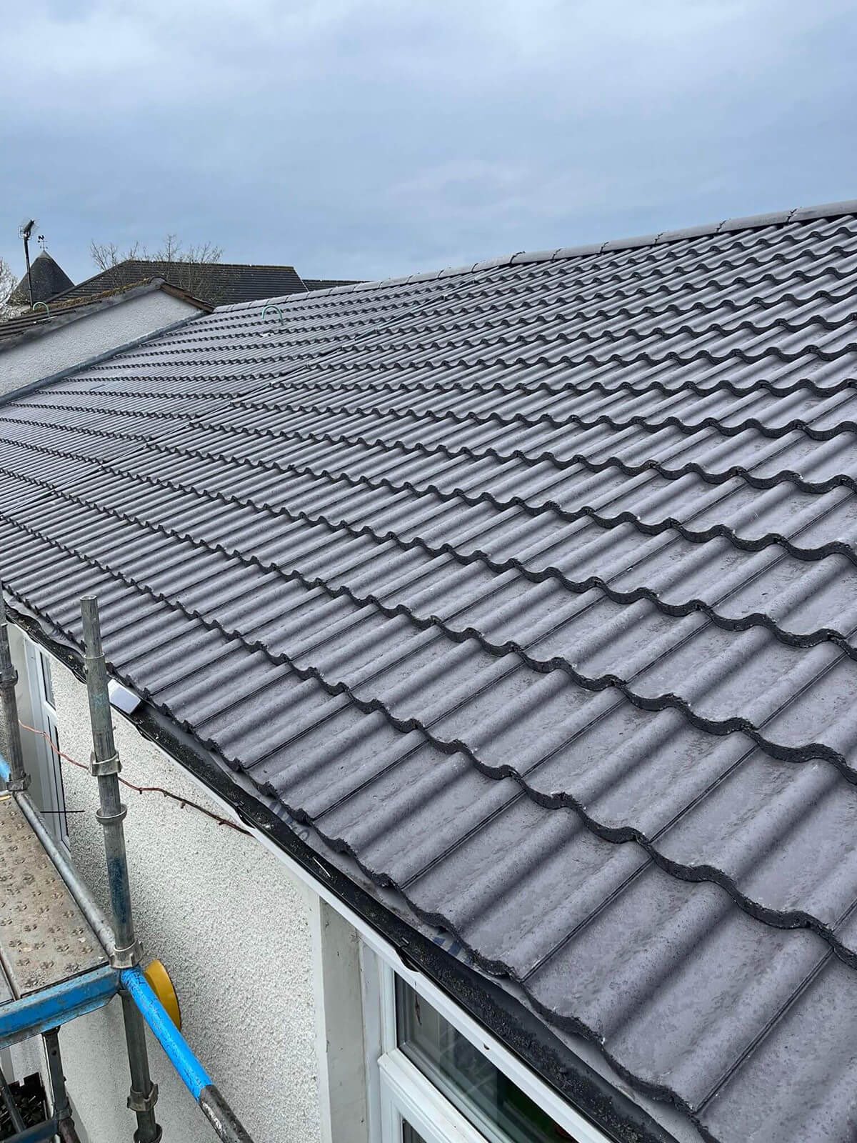 Professional roofing work by JB Contractors in Plymouth - new concrete tile installation
