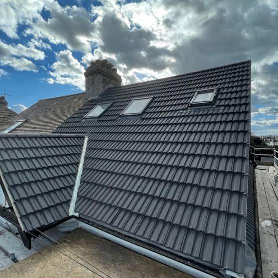 Complete roof replacement with skylights in Cornwall by JB Contractors
